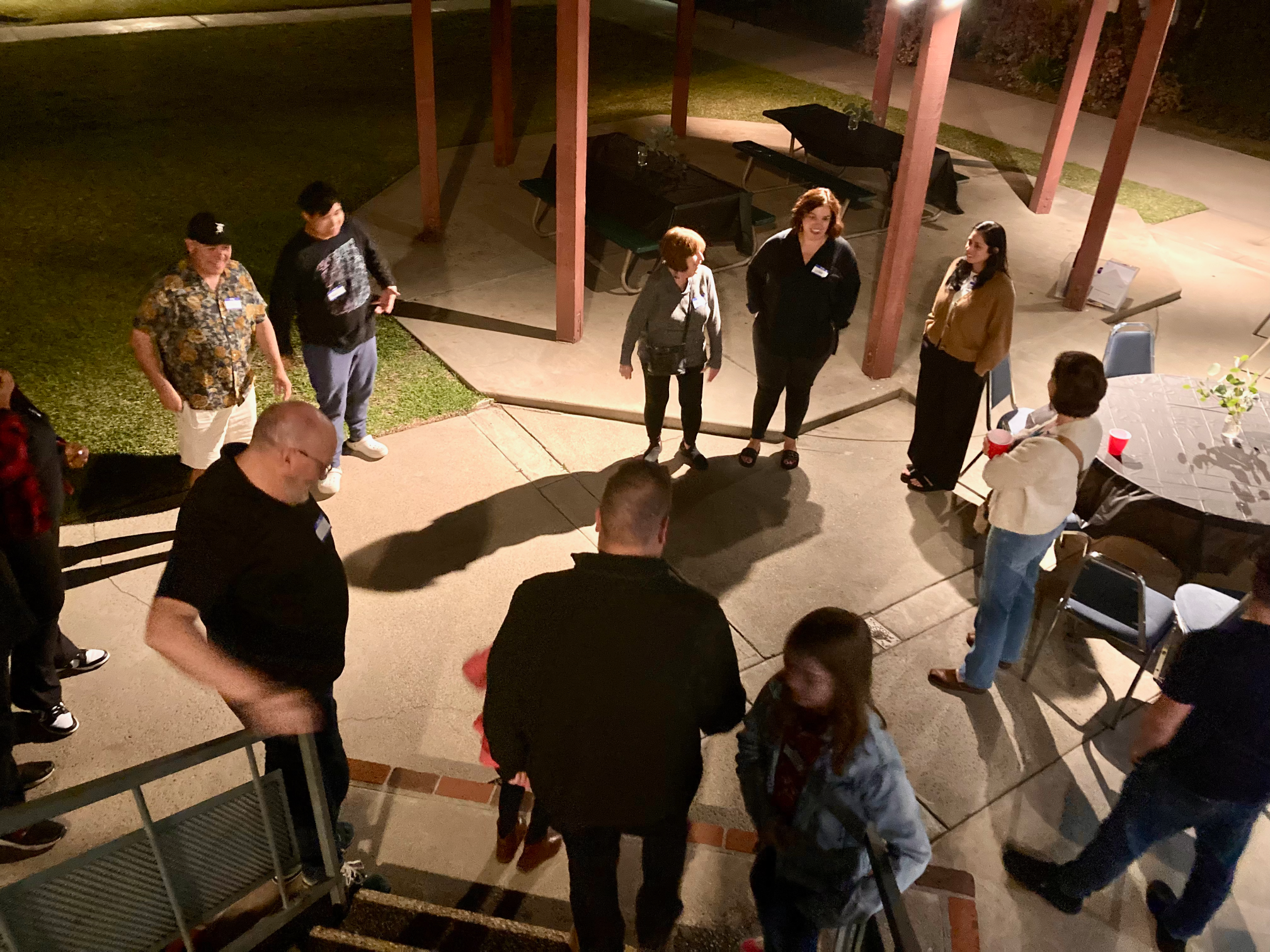 Prayer circle@0.5x House of Hope people standing in a prayer circle